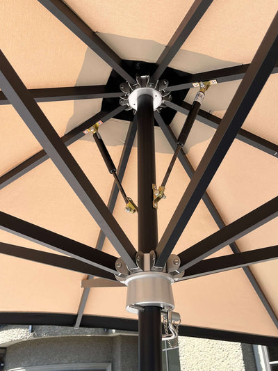 Underneath view of the RM sun Unbrella (stripe) 8x8, showcasing its sturdy structure and canopy design.