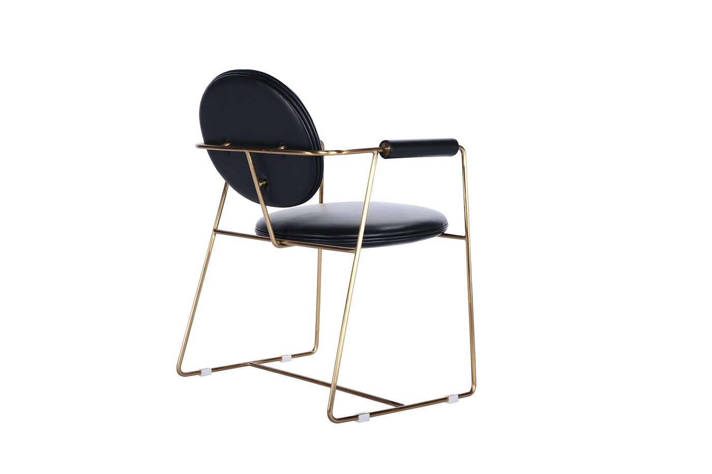 Mera chair with a gold bent metal frame and black leather upholstery, perfect for dining room elegance.