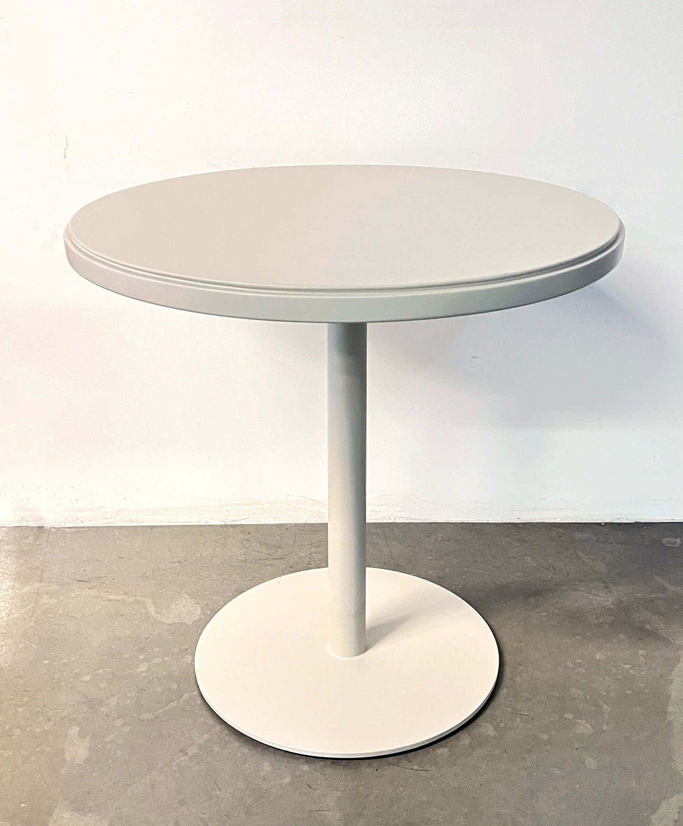 Retro coffee shop table in white, 30-inch round design, perfect for small spaces or commercial use.