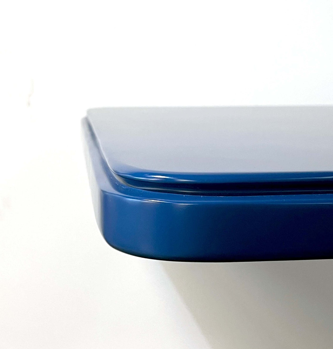 Close-up of a stylish blue retro coffee shop table with a lacquer finish, ideal for small spaces and commercial use.