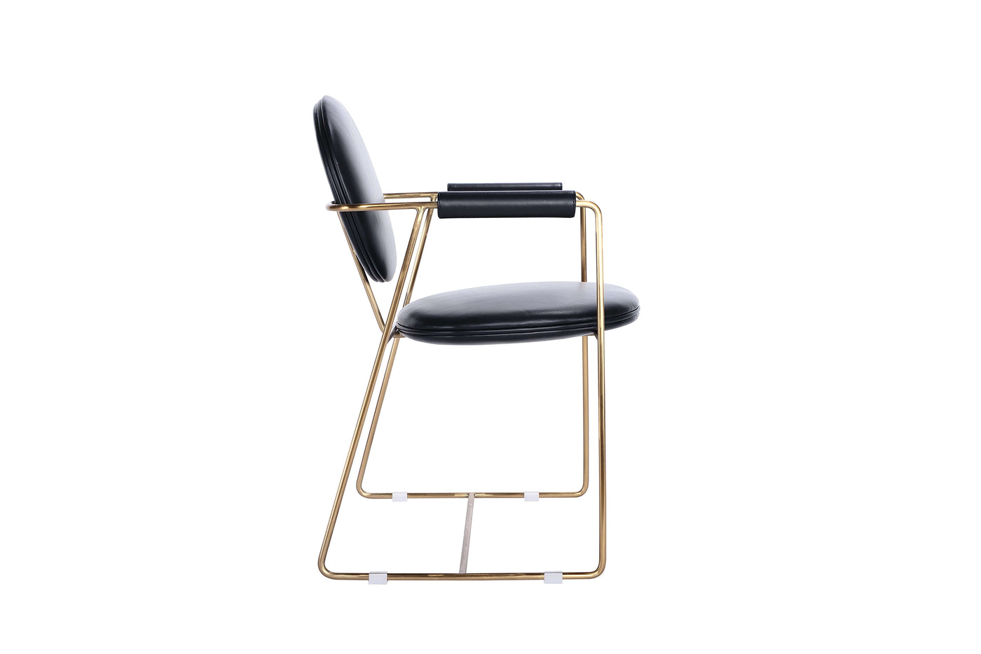Mera chair with a black upholstered seat and gold metal frame, showcasing exquisite style and design for dining rooms.