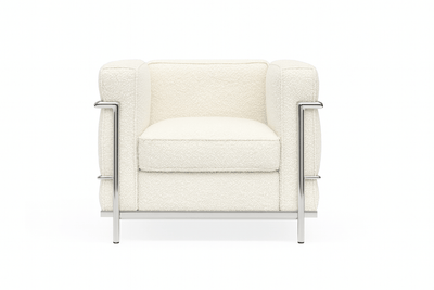 LC2 petite armchair in soft cream fabric with chrome accents, classic mid-century modern design, perfect for stylish interiors.