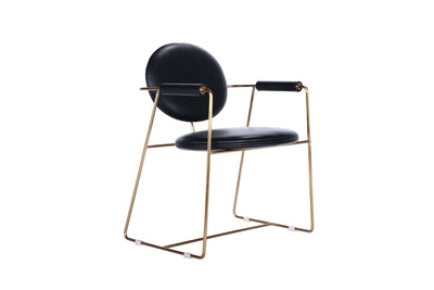 Mera chair with bent metal frame, upholstered seating cushion, and gold accents, perfect for stylish dining rooms.