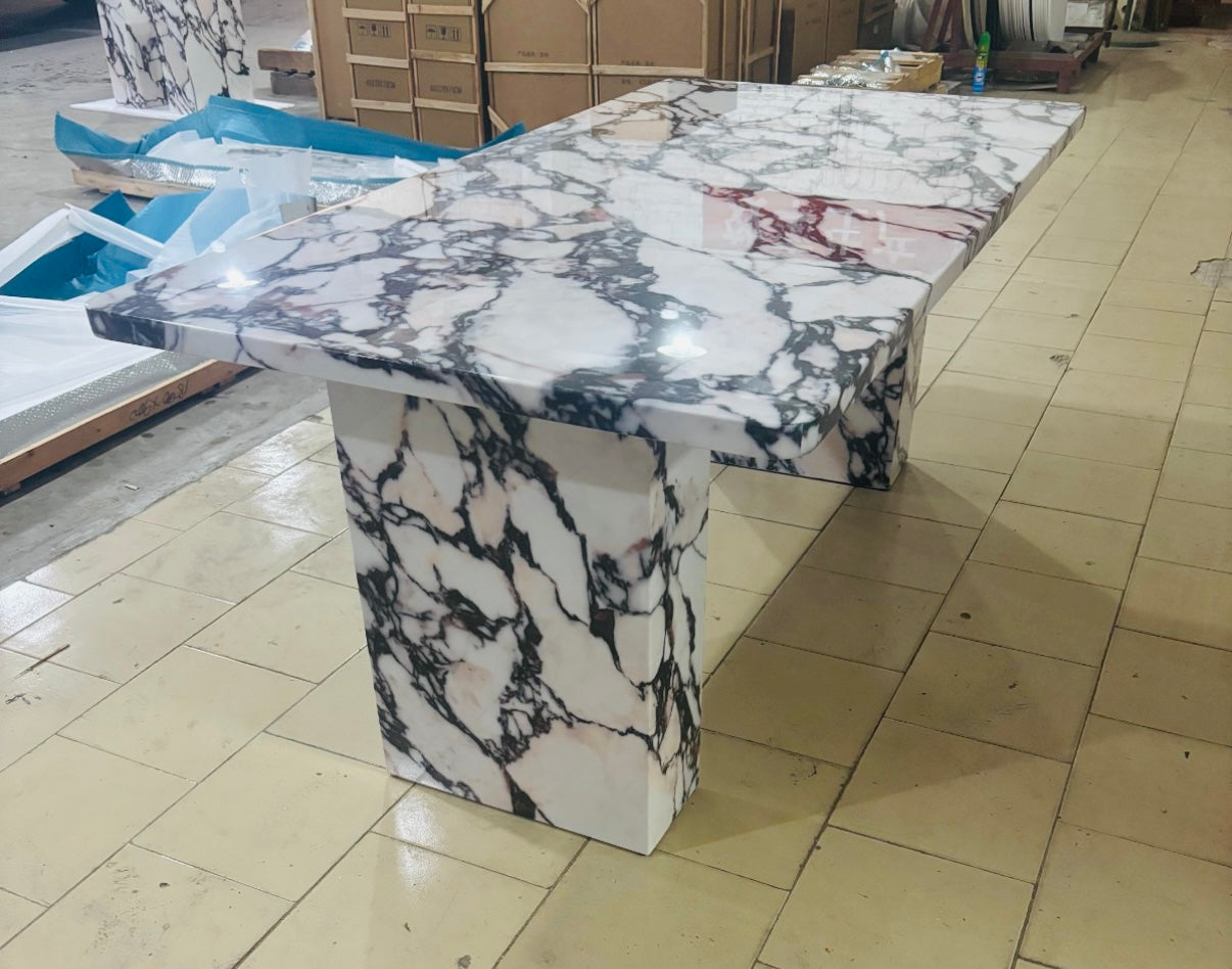 Calcutta faux marble dining table.