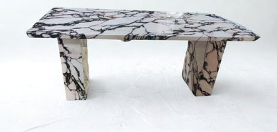 Calcutta faux marble dining table.